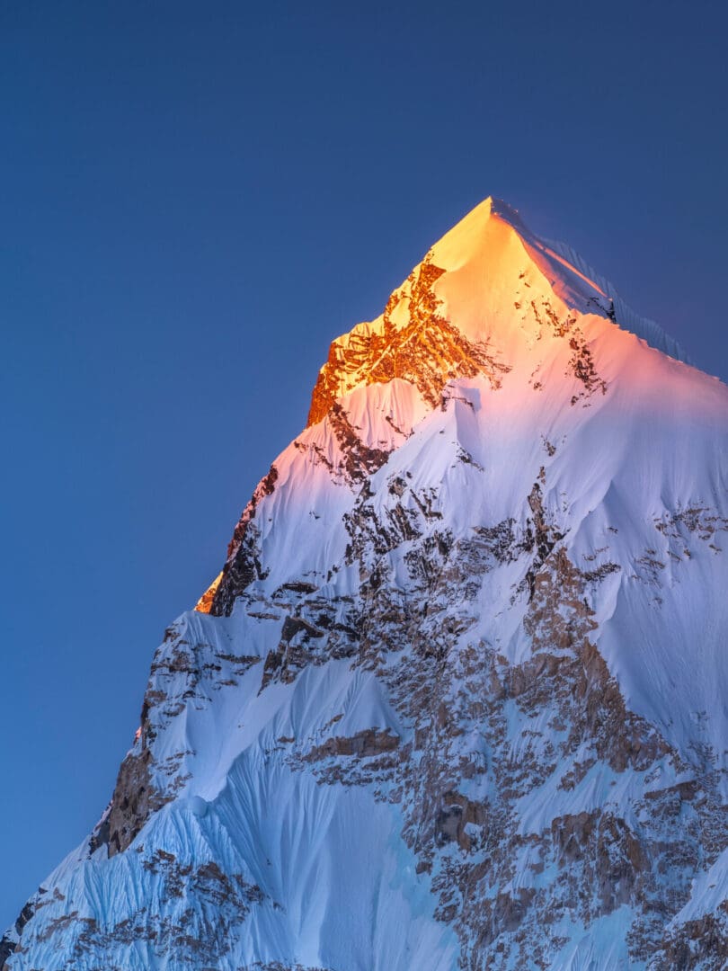 last golden light on the snow peak in Himalaya in Nepal